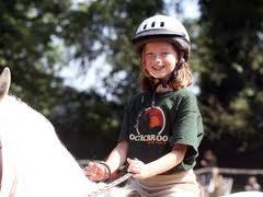 girl riding white horse